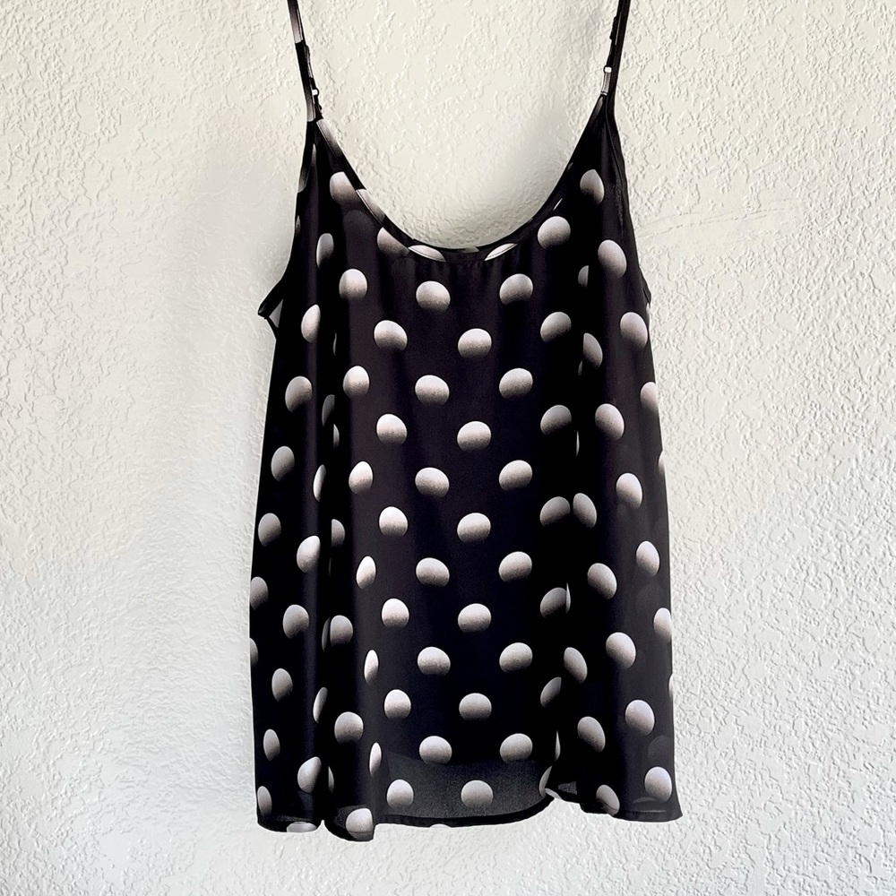 APT. 9 top. 100% polyester with adjustable straps.